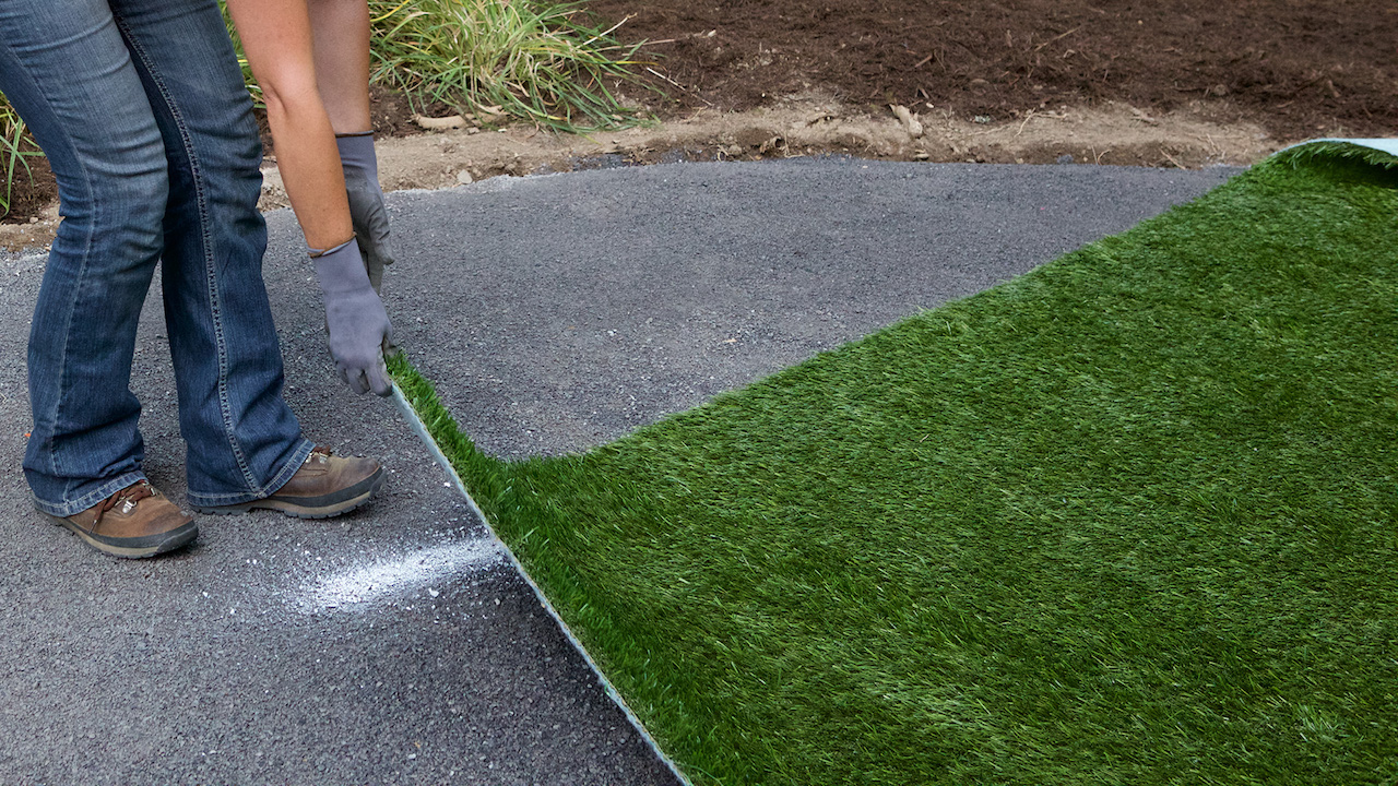 Pulling edge of turf into position