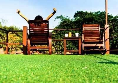 Woman relaxing on artificial grass lawn