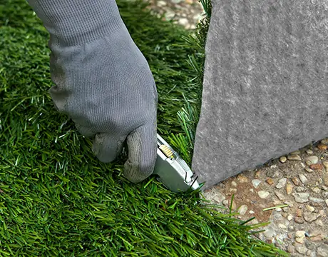 Cutting through turf with utility knife